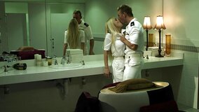 A pair of people is in the restaurant toilet, having some sex there