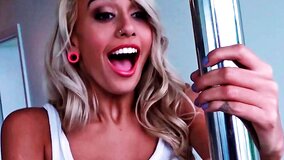 Pretty girl is dancing around a stripper pole